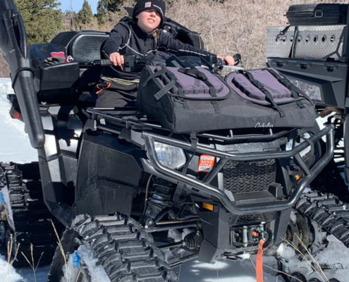 Boy with Snow Vehicle